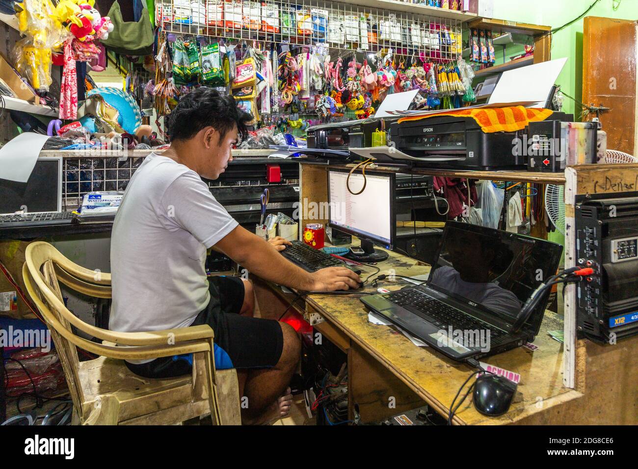 Filipino small business owner working at their shop
