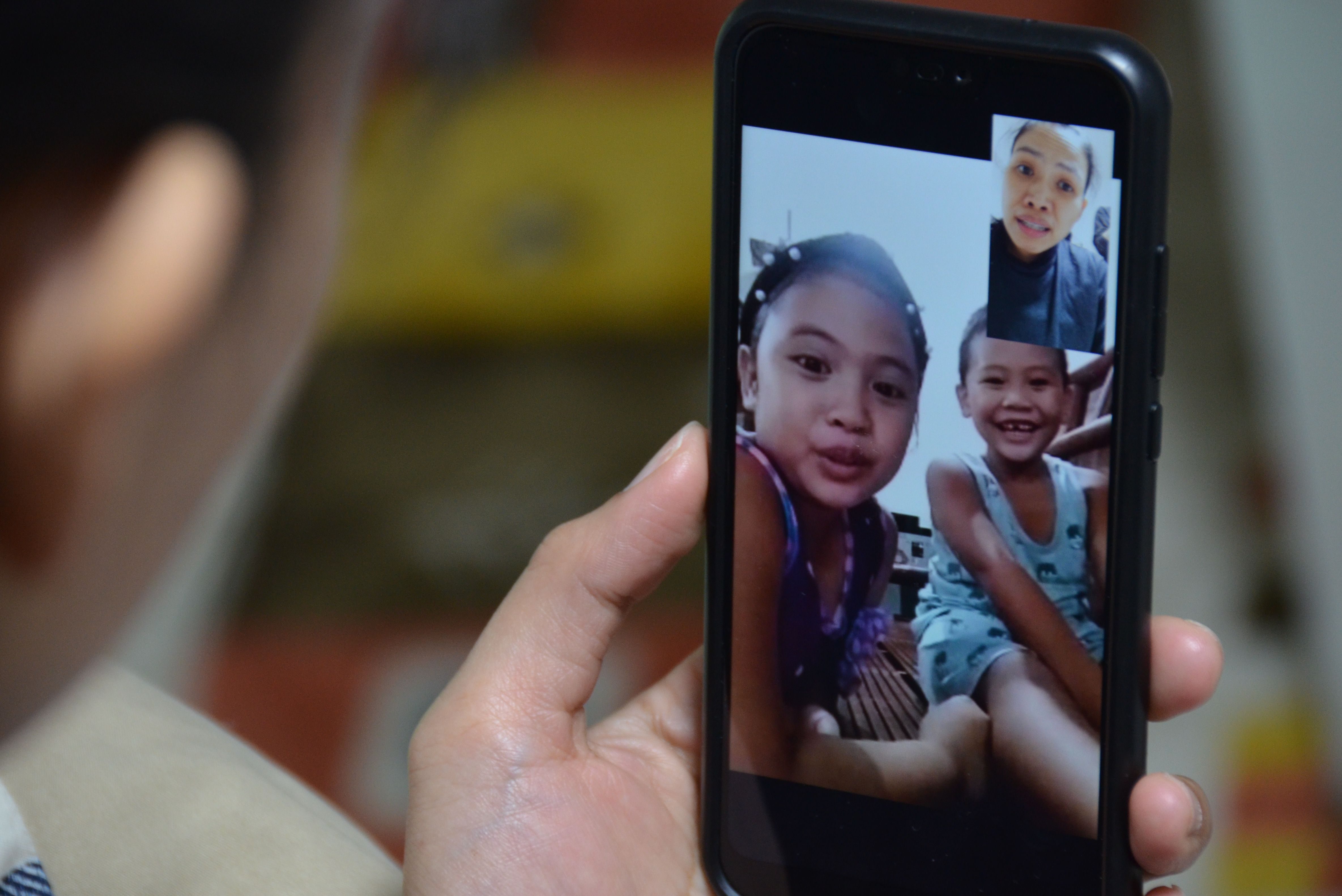 Overseas Filipino worker connecting with family back home